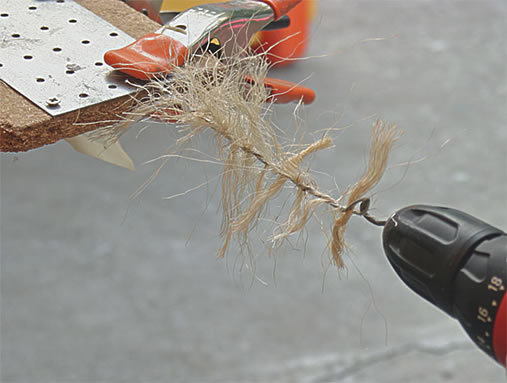 Clamp the L end to a board and hook the wire hook bit into the other 